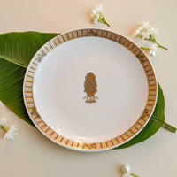 Decorative plate with floral design on a leaf and flowers