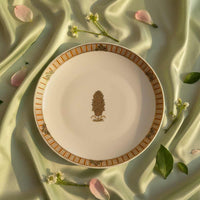 Decorative plate with floral design on a soft fabric background