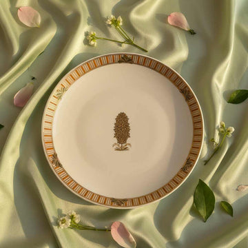 Decorative plate with floral design on a soft fabric background