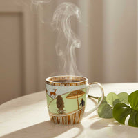 Steaming mug with decorative design on a light surface with a plant