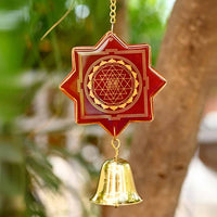 Decorative Red Shree Yantra hanging with bell and 24 carat gold on the Red Glass