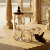 Decorative premium gold glasses & lids on a stone surface