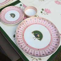 white and pink base with centre peacock motif