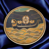 Decorative plate with a boat and floral design on a blue satin background